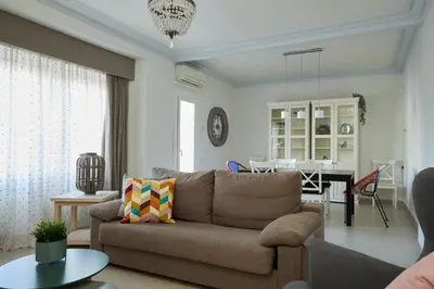 a living room with a couch and a table at Casa Cosi - Casanova 4 in Barcelona