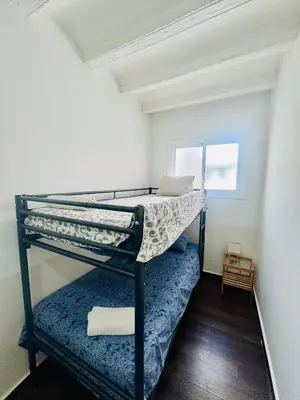 a bedroom with a bunk bed in a room at 09 Apartament born 4 2 in Barcelona