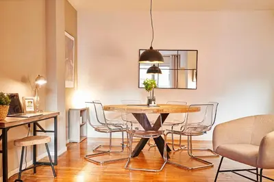 a dining room with a table and chairs at Love Local Life Near Sagrada Familia by MyRentalHost in Barcelona