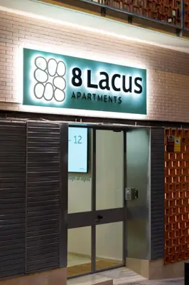 an entrance to an airport with a sign that reads lionsagents at 8 lacus BAIKAL in Hospitalet de Llobregat