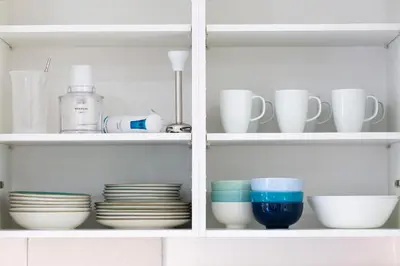 a cabinet filled with dishes and cups and plates at 8 lacus VICTORIA in Hospitalet de Llobregat