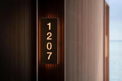 a close up of a clock on the side of a door at Hotel Marina Badalona in Badalona