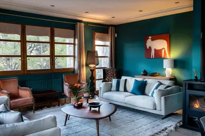 a living room with a couch and a fireplace at Villa Marco in Canyelles