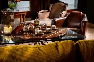 a living room with a coffee table with candles on it at Villa Marco in Canyelles