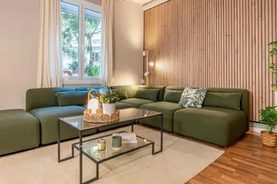 a living room with a couch and a table at Sagrada familia Secret Apartment in Barcelona