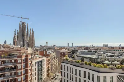 a view of a city with a cathedral and buildings at 1521 - AB Sagrada Família Comfort in Barcelona