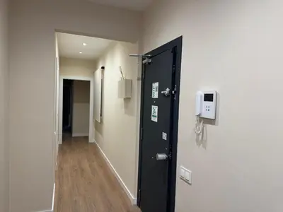 a room with a black door and a hallway at Anais Apartments by gaiarooms in Barcelona