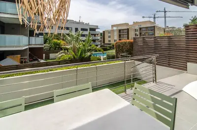 a balcony of a building with stairs and plants at Sitges Spaces Garden Paradise 3 bedroom, 3 bathroom, huge PRIVATE garden-terrace, pool- sleeps up to 8 in Sitges