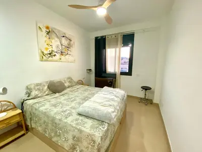 a bedroom with a bed and a ceiling fan at Terraza Relajante Galvani in Terrassa