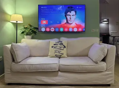 a white couch in a living room with a tv at Abbott apartment - 1 min from the beach - 100m2 - sleeps 8 in Sitges