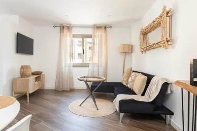 a living room with a couch and a chair at Stylish&bright Close To Subway in Esplugues de Llobregat