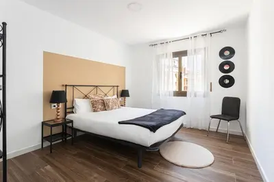 a bedroom with a large white bed and a window at Stylish&bright Close To Subway in Esplugues de Llobregat