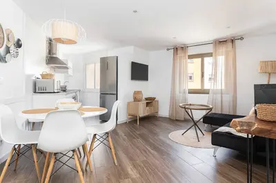 a kitchen and living room with a table and chairs at Stylish&bright Close To Subway in Esplugues de Llobregat