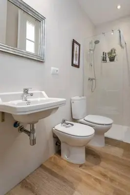 a bathroom with a sink and a toilet and a shower at Lovely Designed House Connected To Center in Cornellà de Llobregat