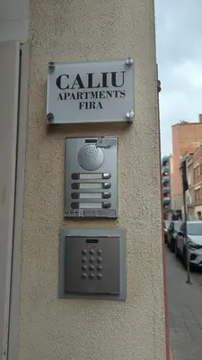 a sign on the side of a building that says california appliances pizza at Caliu Apartments Barcelona - Fira in Hospitalet de Llobregat