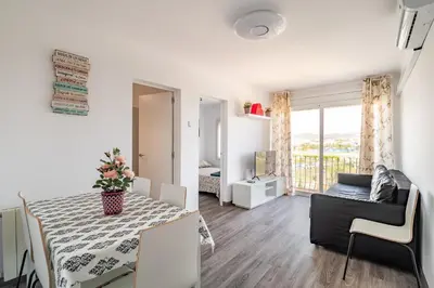 a living room with a table and a couch at LOVELY APARTMENT Barca 2 in Sant Adria de Besos