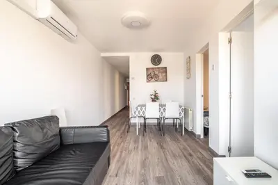 a living room with a couch and a table at LOVELY APARTMENT Barca 2 in Sant Adria de Besos