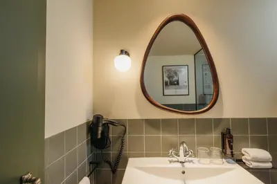 a bathroom with a sink and a mirror at H Regas Adults Only in Barcelona