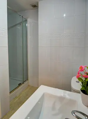 a bathroom with a bath tub and a toilet at Molins Apartment by Hello Homes Sitges in Sitges