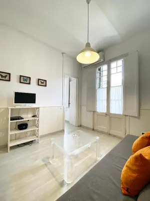 a living room with a couch and a coffee table at Stay U-nique Apartments Gaudi II in Barcelona