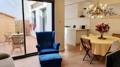 a kitchen and dining room with a table and chairs at Opening Doors Vilassar. Family house Beach & Relax in Vilassar de Mar