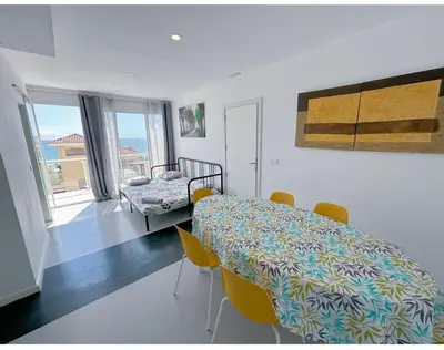 a dining room with a table and chairs at HUG HOTEL2022 in El Carrer del Canonge