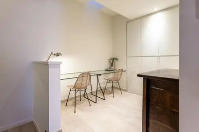 a kitchen with a table and chairs in a room at Casa 20 minutos de Barcelona y WIFI alta capacidad in Sant Cugat del Vallès