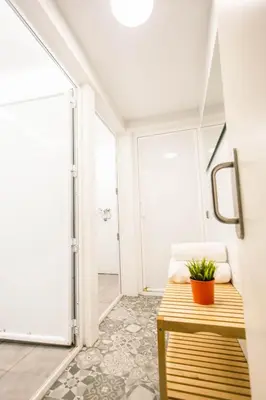 a bathroom with a bench with a plant on it at 360 Hostel Borne in Barcelona
