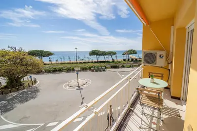 a balcony with a view of a parking lot at HomeHolidaysRentals Eiffel - Costa Barcelona in Pineda de Mar