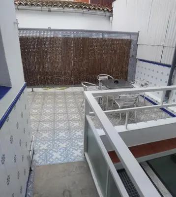 a balcony with a fence and a table on it at Barcelona 2 Habitaciones in Hospitalet de Llobregat