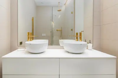 a bathroom with two white bowls on a counter at Luxury Paseo de Gracia Casa Batlló in Barcelona