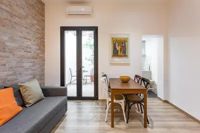 a living room with a couch and a table at Stay U-nique Apartments Travessera II in Barcelona