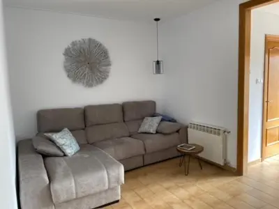 a living room with a couch and a table at Piso céntrico con Parking a 20min de Barcelona in Terrassa