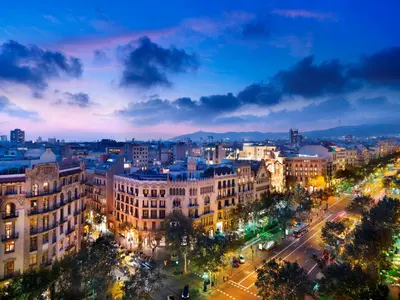 a view of a city at night with buildings at Tendency Apartments 5 in Barcelona