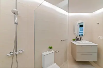 a bathroom with a shower and a toilet and a sink at Tendency Apartments 5 in Barcelona