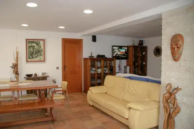 a living room with a couch and a table at Casa Martina in Cardedeu