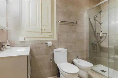 a bathroom with a toilet and a sink and a shower at Be Barcelona Eixample Universidad in Barcelona