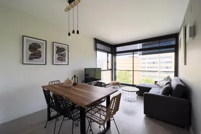 a living room with a table and a couch at chicStays Apartment Ciutadella Park in Barcelona