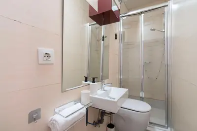 a bathroom with a toilet and a shower at Hostal Sant Antoni in Barcelona