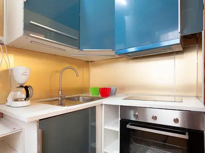 a small kitchen with a sink and a stove at Esquirol in Barcelona