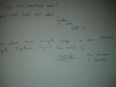 a white refrigerator with writing on the side of it at Hostal Aslyp 114 in Barcelona