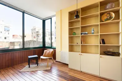a room with a window and a chair and a table at Moianes Apartment by Olala Homes in Barcelona