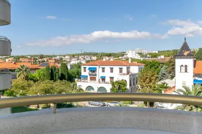 a view of a city from a balcony at ESTRELLA DE MAR Sitges in Sitges