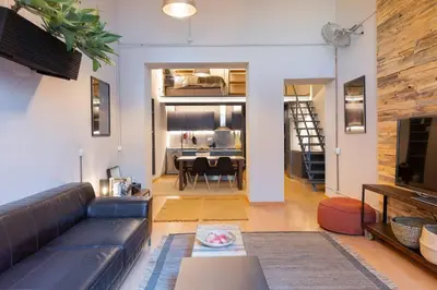 a living room with a couch and a table at MOJAVE - Modern Duplex with Private Terrace in Barcelona