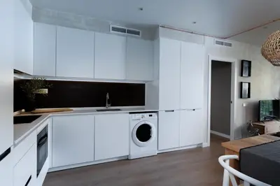 a bathroom with a white toilet and a sink at SONORA - Bright Apartment with view of Sagrada Familia in Barcelona