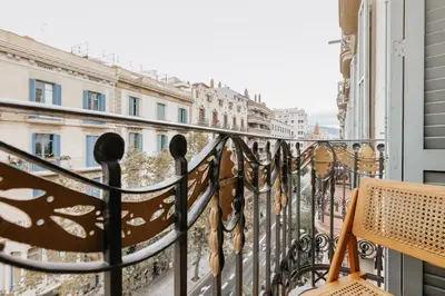 a dining room with a wooden table and chairs at LLANOS - Two Bedroom apartment in heart of the city in Barcelona