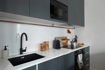 a bedroom with a bed with a painting on the wall at DENALI - Stylish apartment in center of Barcelona in Barcelona