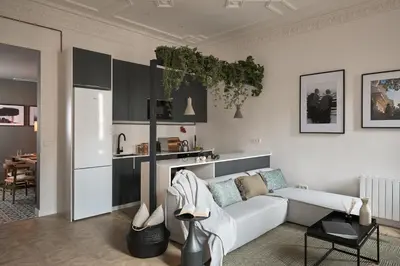 a living room with a white table and chairs at DENALI - Stylish apartment in center of Barcelona in Barcelona