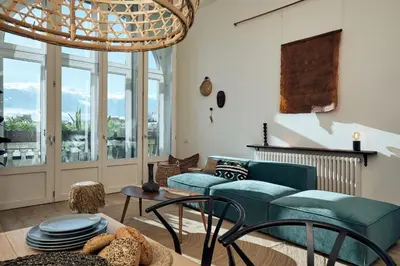 a room with white furniture and a large window at SAPO - Two bedroom in the heart of Barcelona in Barcelona