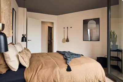 a kitchen and dining room with a table and chairs at AGAFAY - Two bedroom apartment in Sagrada Familia in Barcelona